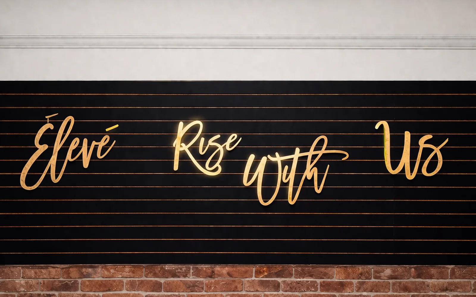 The Élevé studio — Rise With Us signage on the wall
